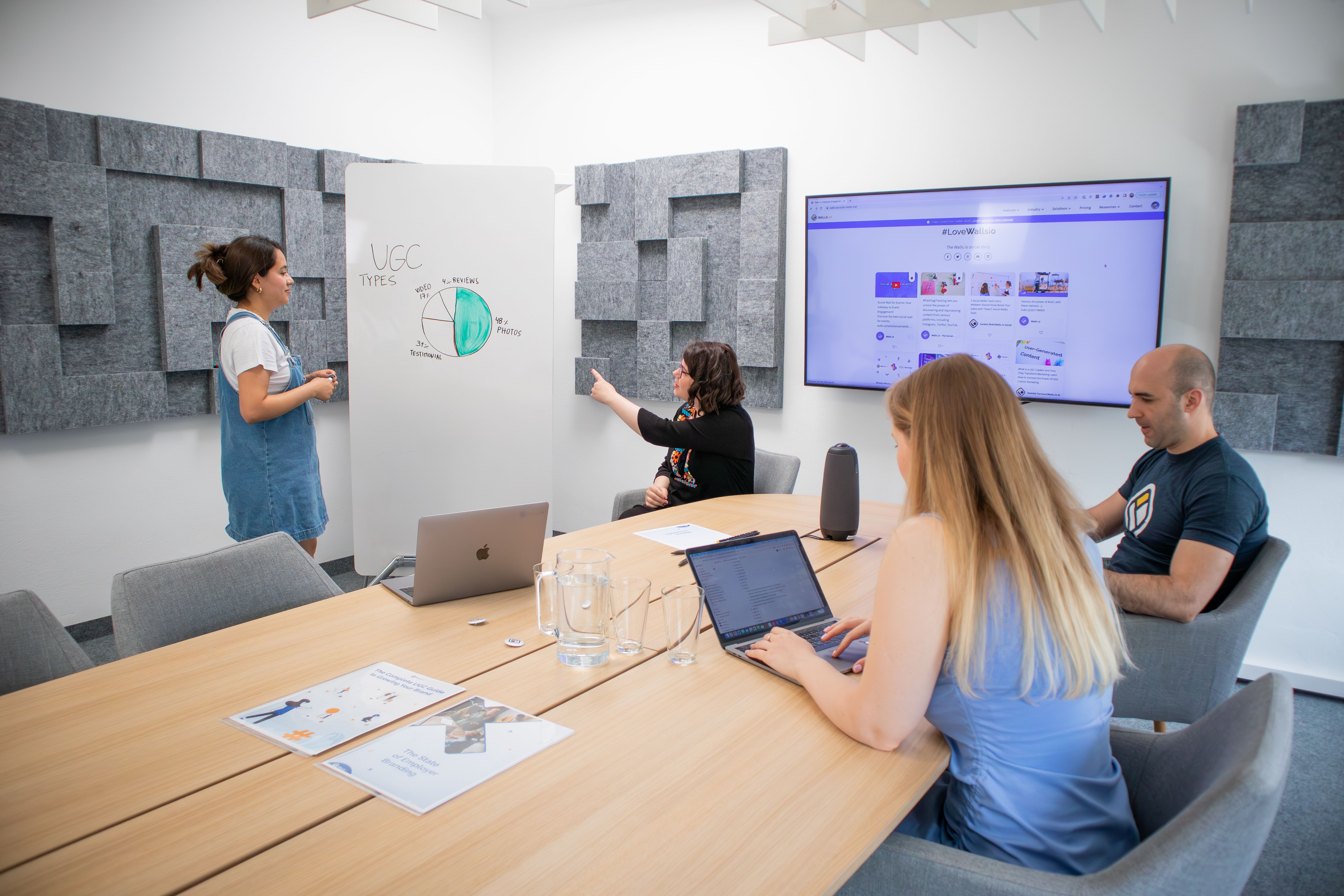 Team reviewing marketing research and campaign analytics